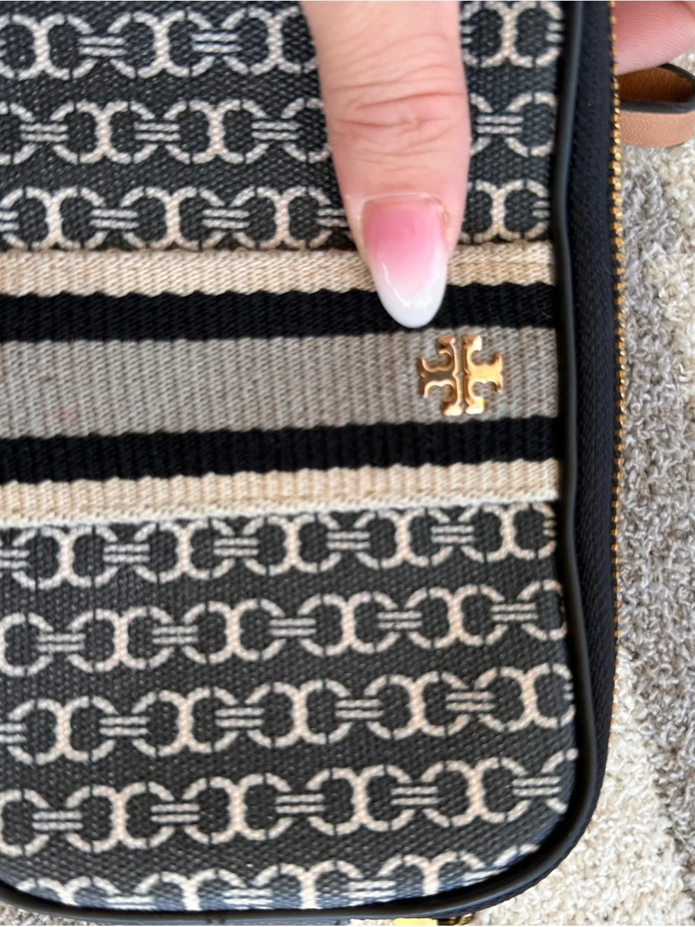 Tory Burch Black and Tan Patterned Logo Wristlet with Stripe Detail
